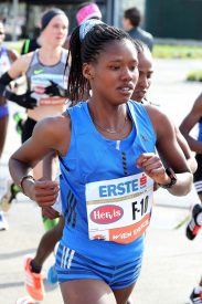 Angela Tanui Flying Kenyan Flag at Scotiabank Toronto Waterfront Marathon